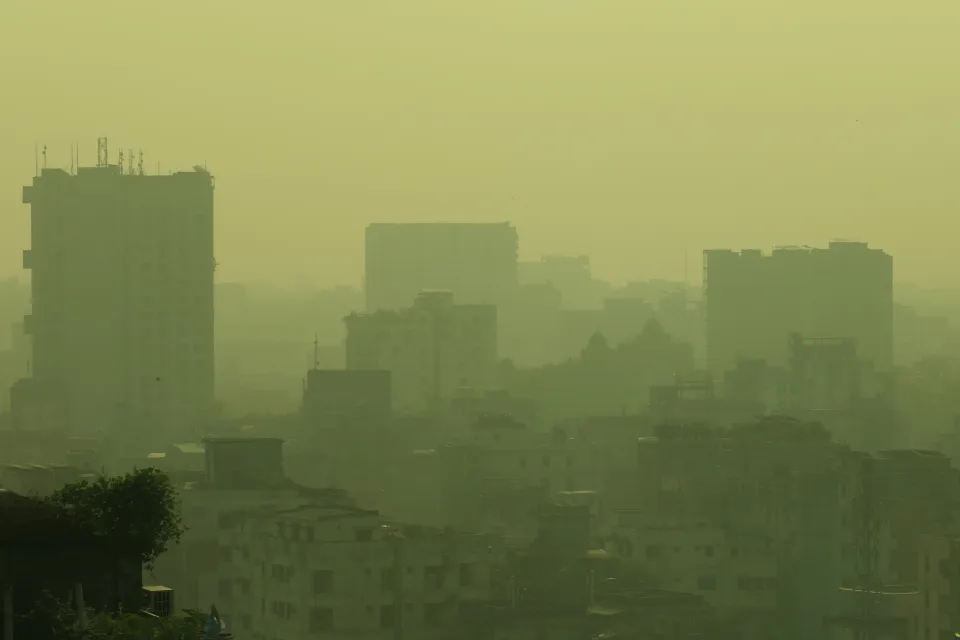 Air pollution is visible in the air around high-rise buildings in Dhaka, Bangladesh.